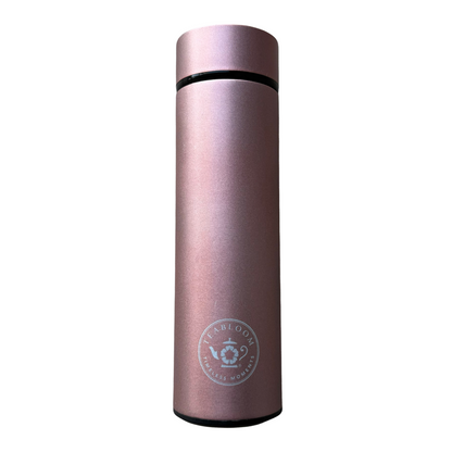 Stainless steel rose gold tea infuser tumbler.