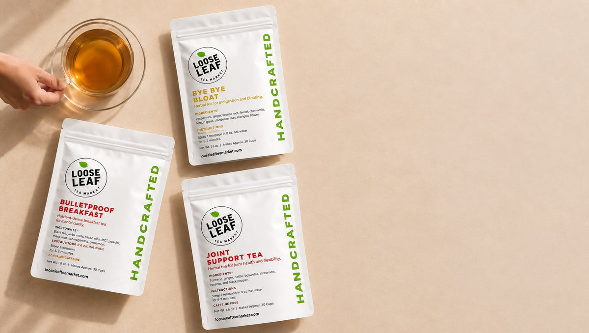 Loose Leaf Tea Market Bye Bye Bloat, Bulletproof Breakfast and Joint Support Tea pouches beside a cup of tea