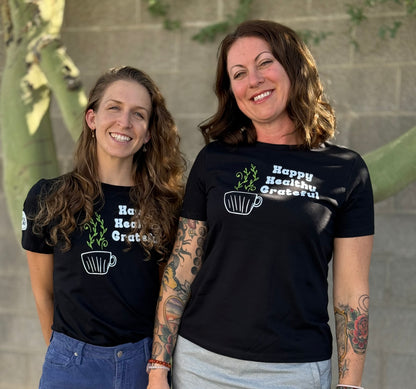 Two women wearing the Happy Healthy Grateful T shirt